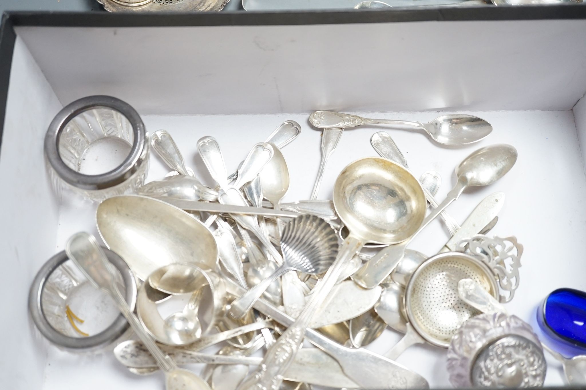 Sundry small silver, white metal and plated items, including a George III silver caddy spoon, French white metal beaker, napkin rings, condiment, tea strainer toilet jar, etc, weighable silver, 24oz.